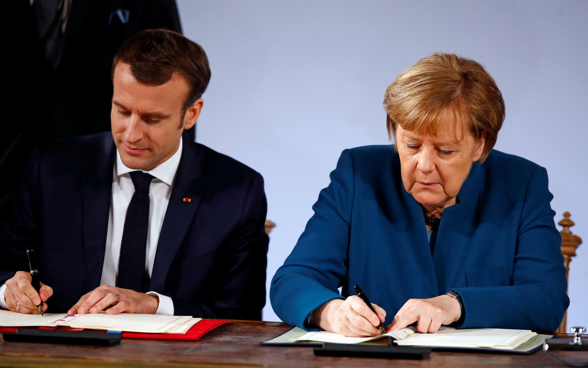 Переговоры франции и германии. Января 2019 г. а. Меркель и э. Макрон в городе Аахен. Меркель и э. Макрон в Аахен. Меркель и Макрон в Ахене 2019. Вольфганг Меркель.